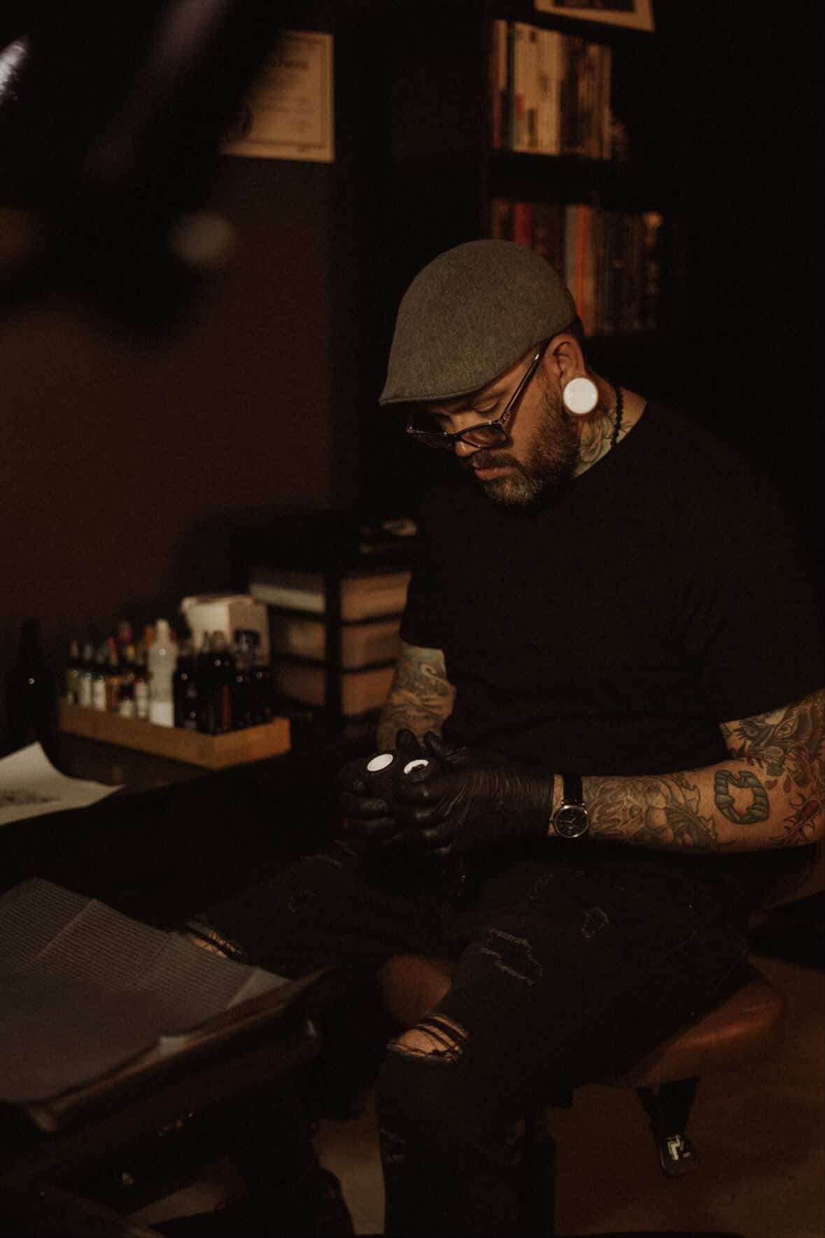 George preparing to tattoo at his workstation