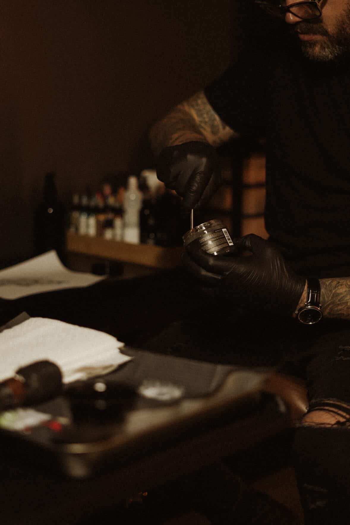 George preparing supplies with gloved hands